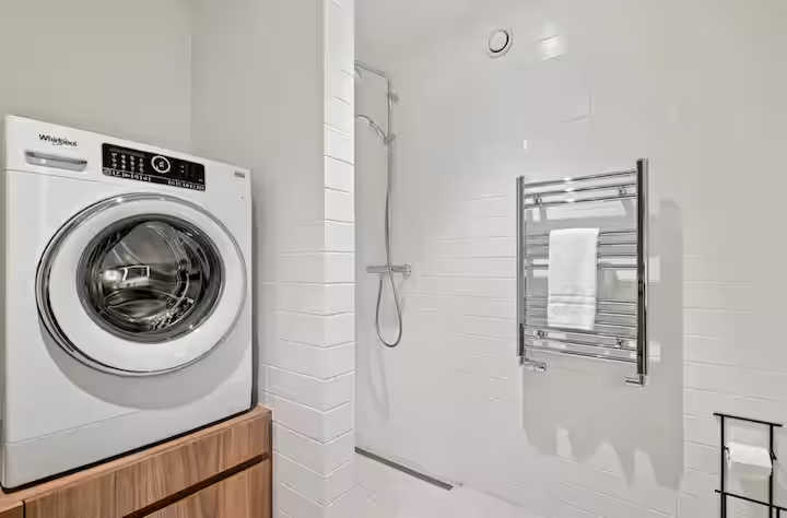 Main bathroom with washer, dryer and walk-in shower