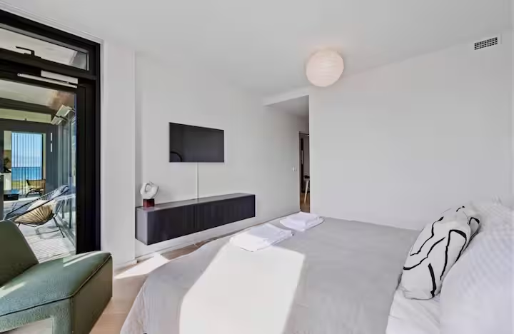 Master bedroom with patio access toward the ocean