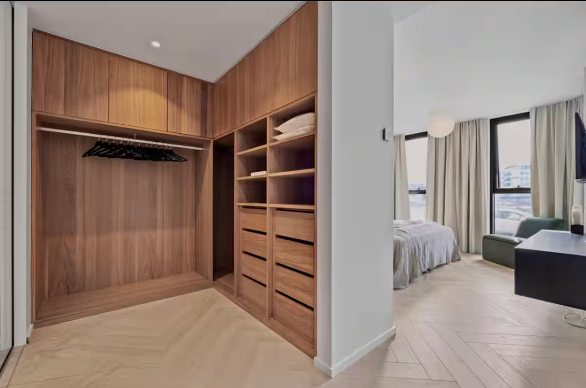 Walk-in closet with custom wood cabinetry