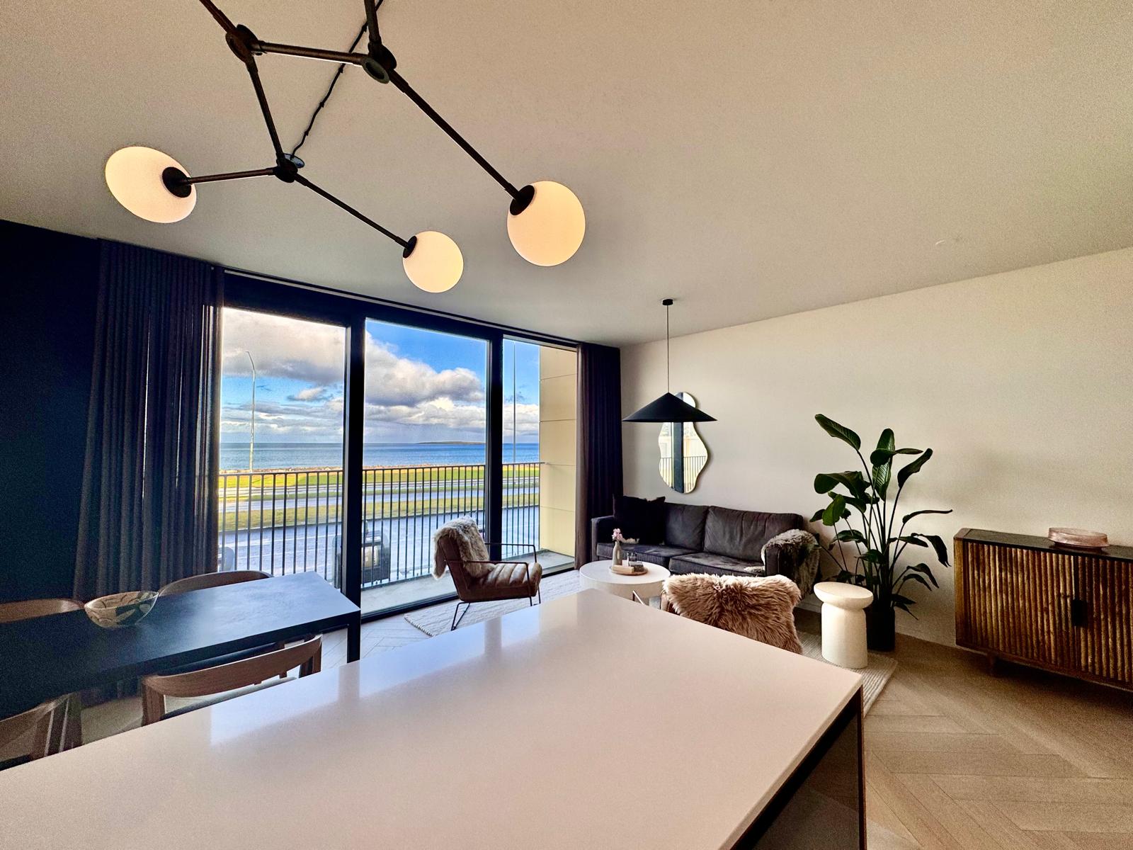 Living room with floor-to-ceiling ocean view