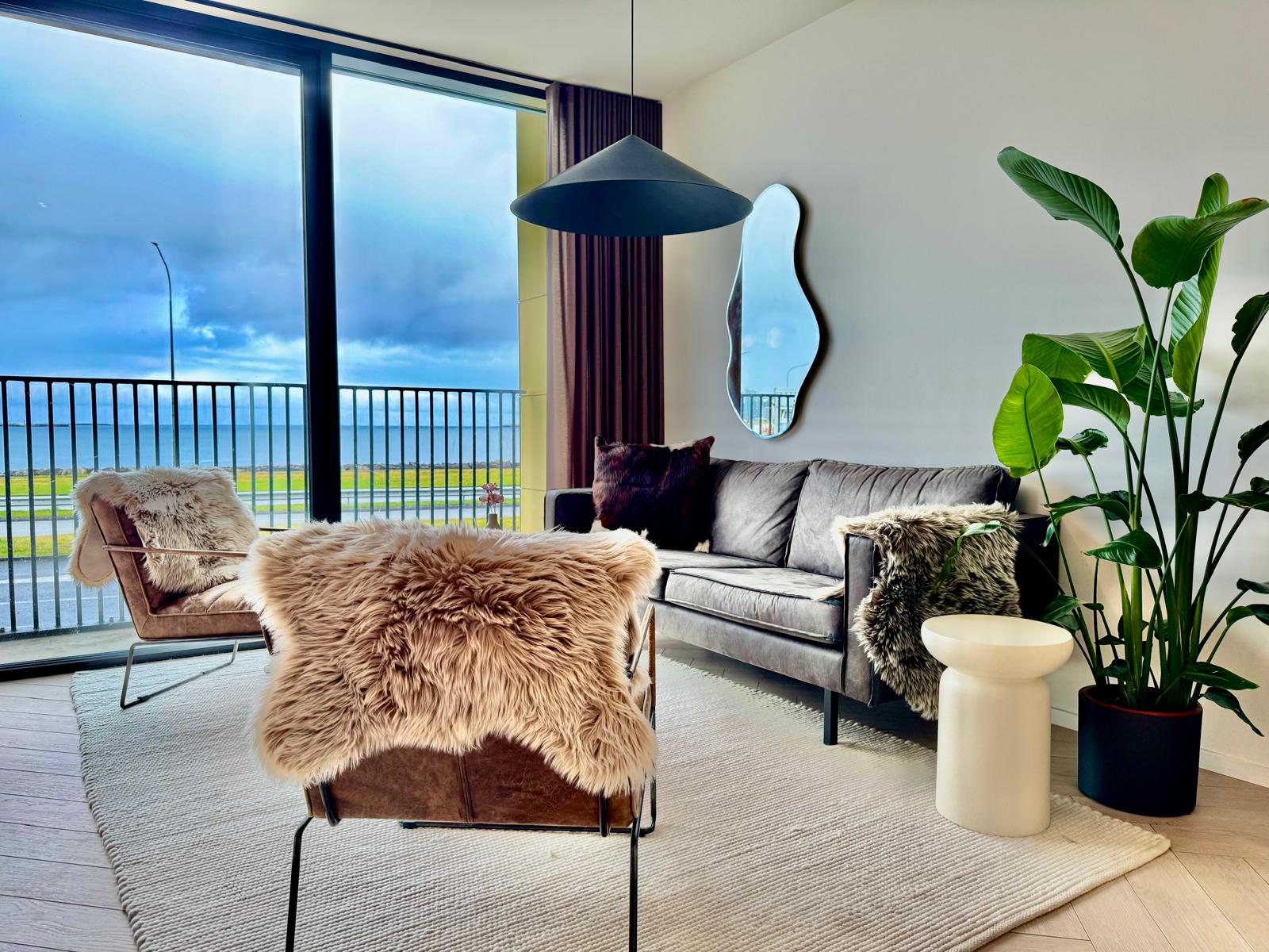 Velvet sofa and sheepskin lounge chairs